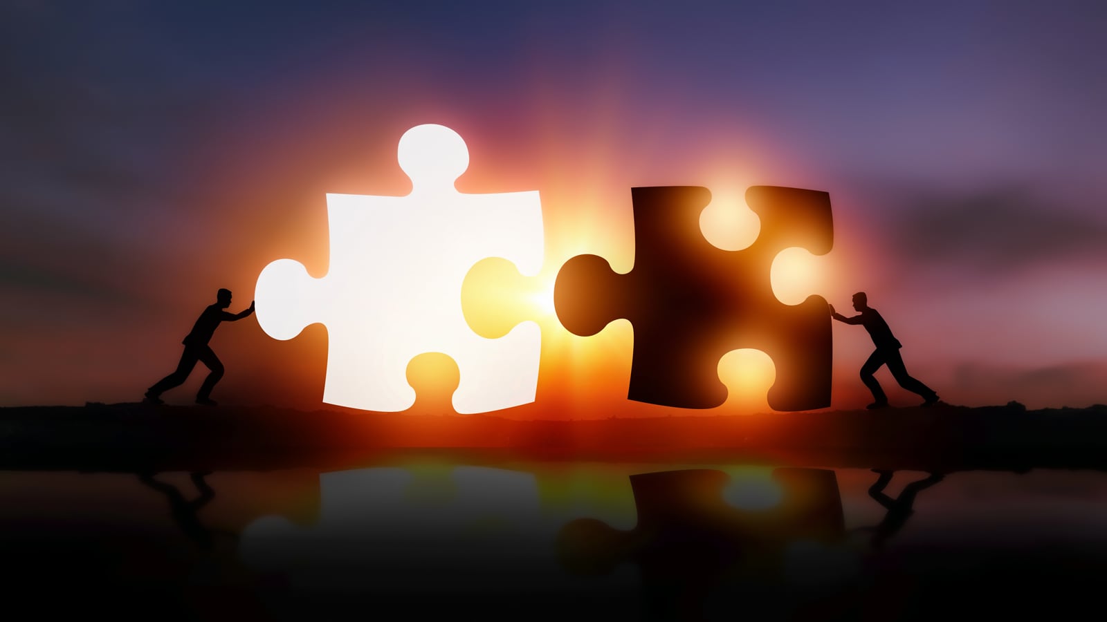 illustrations of two men pushing two large puzzle pieces together