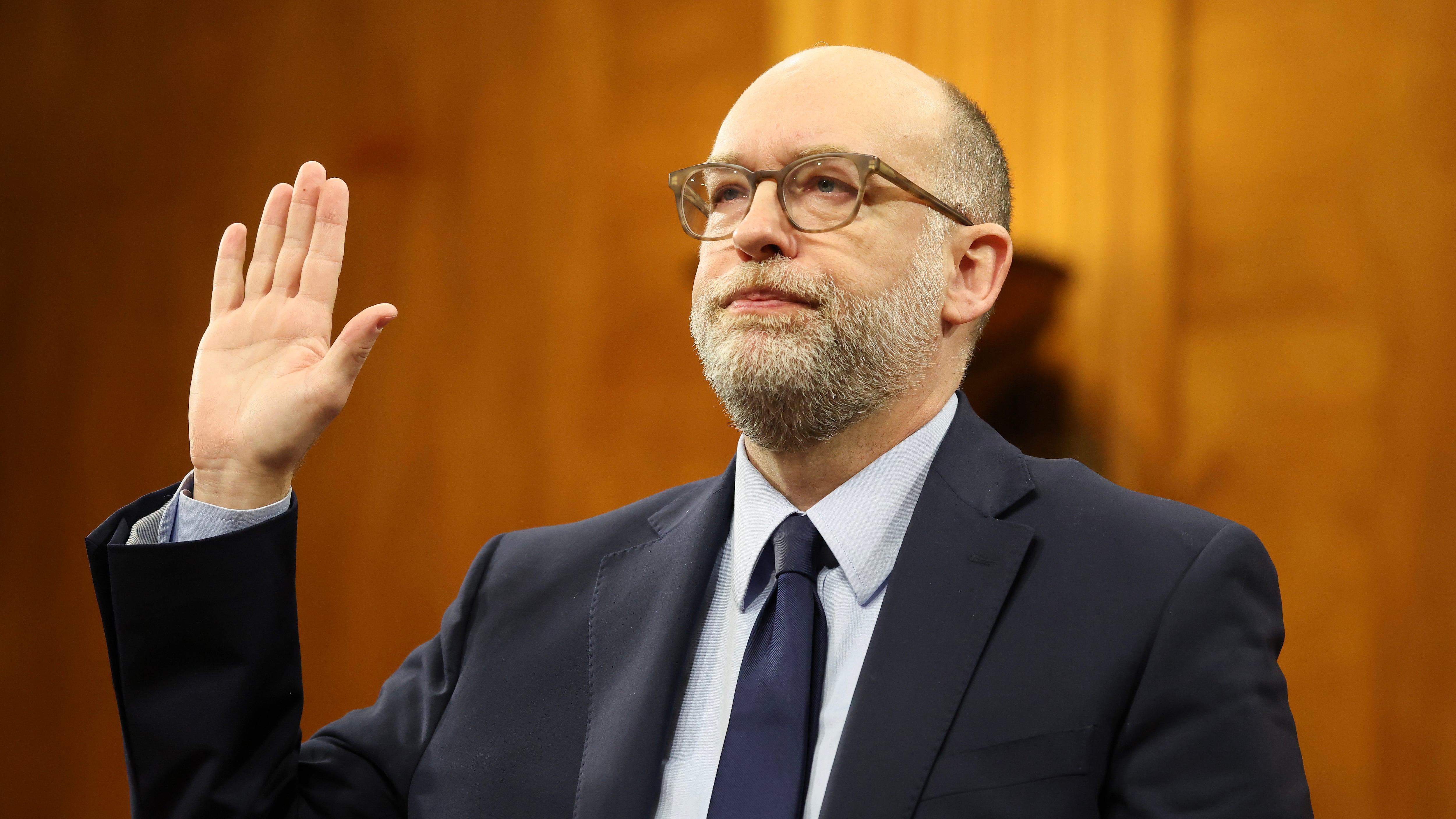 Office of Management and Budget Director nominee Russell Vought is sworn in with a hand raised Jan. 22, 2025, during the Senate Banking Committee nomination hearing in the Dirksen Senate Building in Washington, D.C.